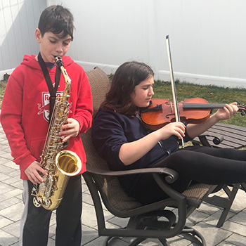 Students playing musical instruments