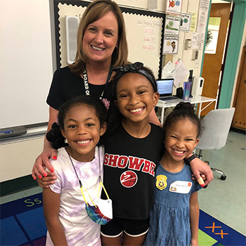 Teacher with three students