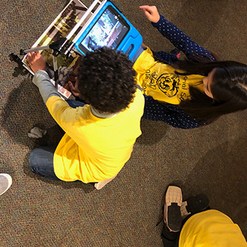Students working with robotics at a museum