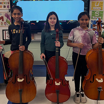 Students holding musical instruments