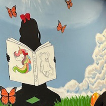 Wall painting of girl reading a book