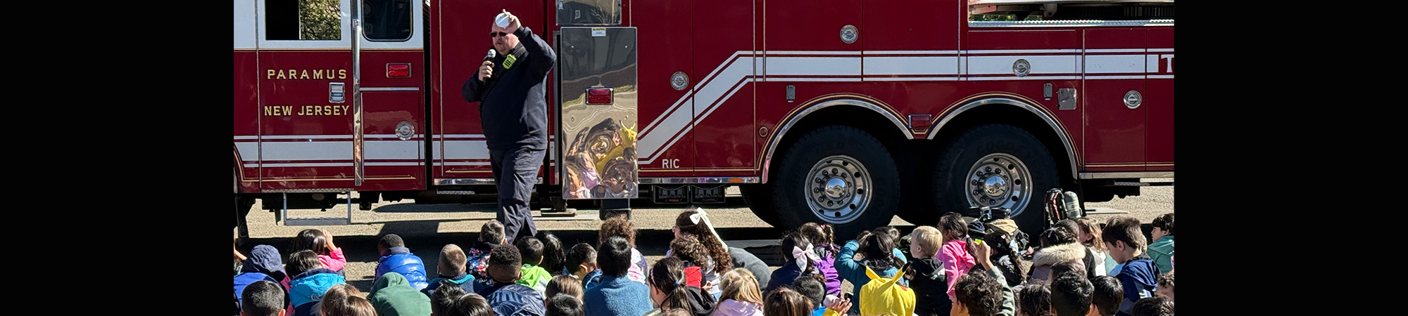 Students enjoying a visit from local fire department