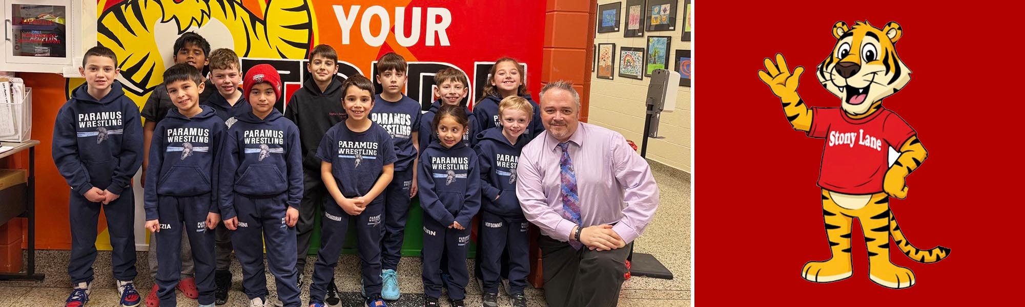 Wrestling team with principal next to Rocky mascot