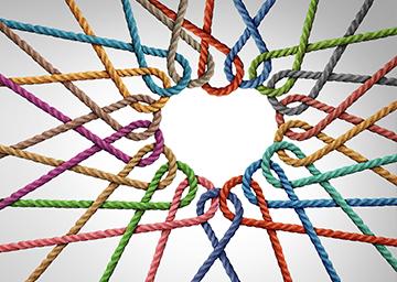 Colored strings in the shape of a heart showing unity