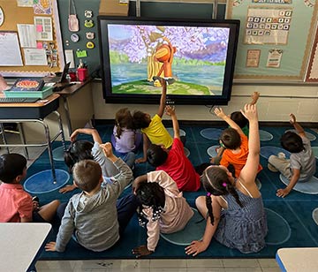 Students doing yoga together in class