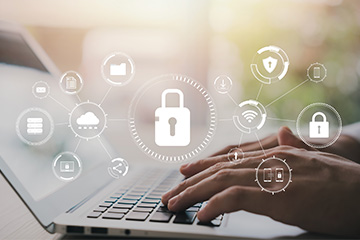 Parent learning about school security on laptop