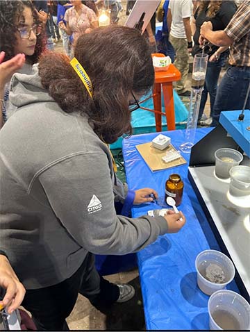 student doing a science experiment