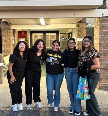Students and staff outside doctor office