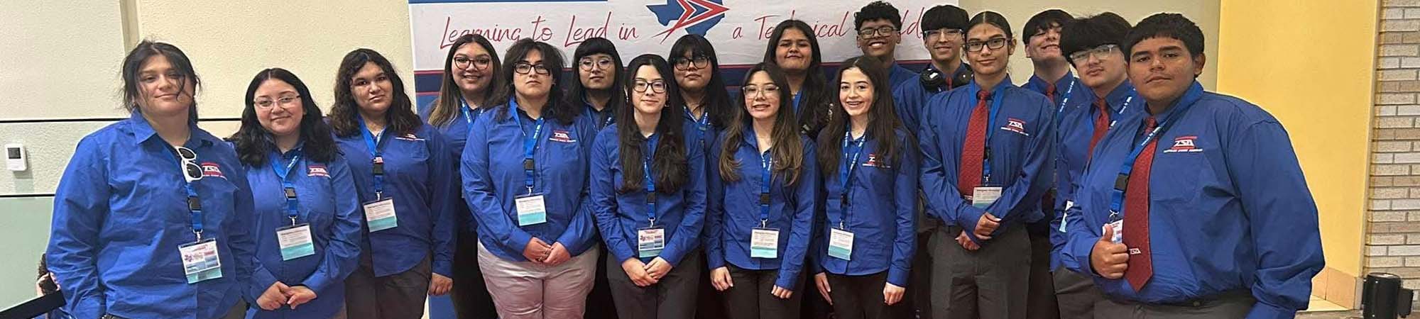 students in matching blue shirts