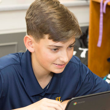 Middle School Student working on a computer