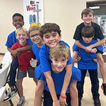 Students giving each other piggy-back rides