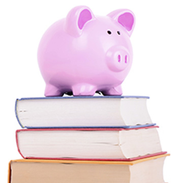 A piggy-bank on top of some books
