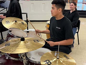 Student playing drums