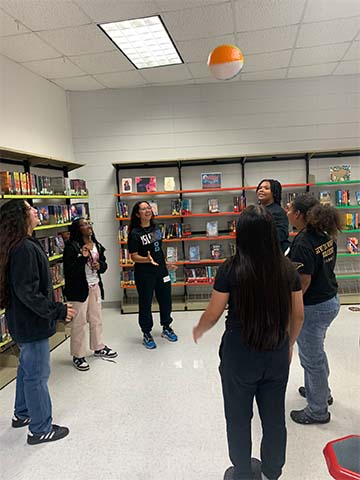 Students playing with a balloon