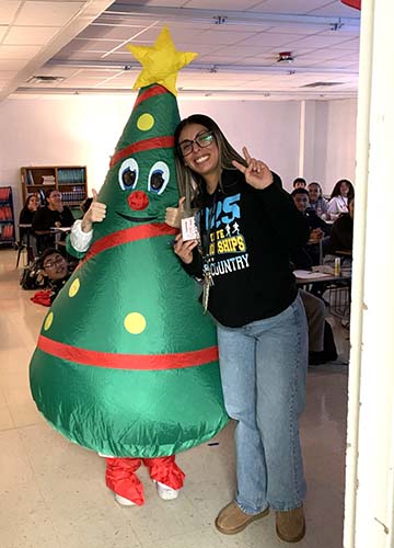 Teacher with blow up tree