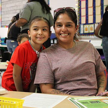 Mother and daughter smiling