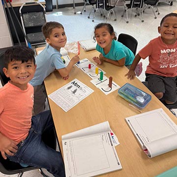 Students working on a math assignment in class Students working on a math assignment in class