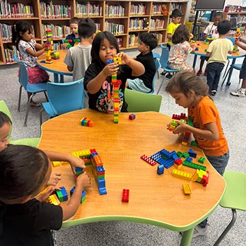 Students playing with Legos in class
