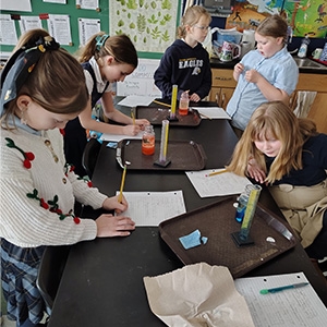Students writing down the results of their experiments