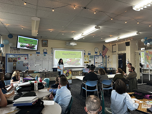 Sixth grade students presenting “Shark Tank” entrepreneurship projects in the classroom