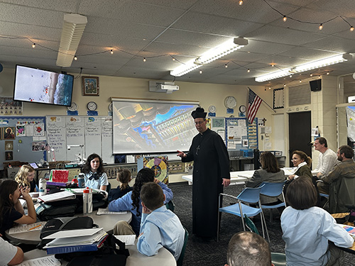 Church representative in the classroom during presentations