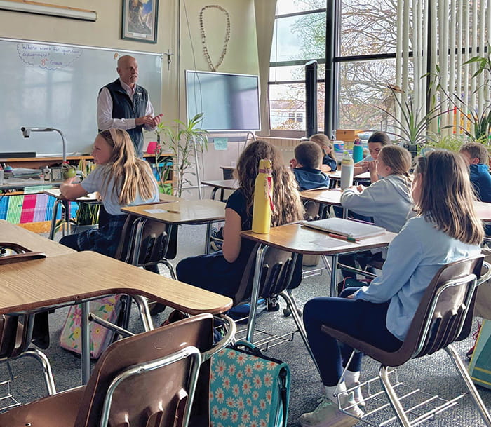 Guest speaker Karl Bohnak and a classroom of fifth graders