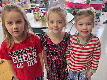 Three little smiling girls