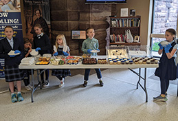 FMCA students getting ready to serve cupcakes and treats