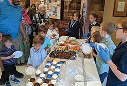 FMCA students serving goodies at St. Peters Cathedral