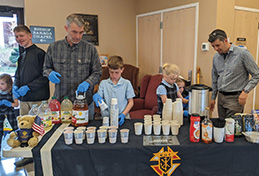 FMCA students and adults serving punch at St. Peters Cathedral