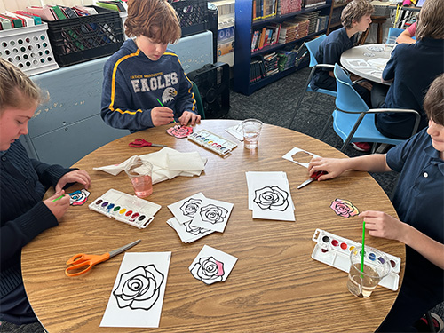 Students painting roses