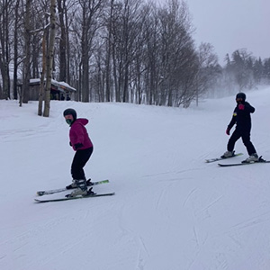 Two students skiing