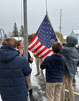 Students raising the US flag