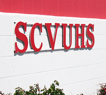SCVUHS on outside campus wall 