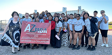 Marching band holding up a banner