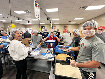 NHS members helping to prepare meals