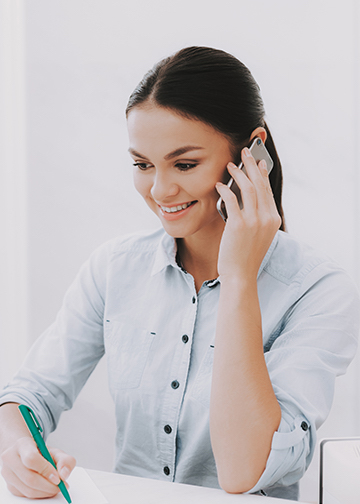 Happy staff member on the phone
