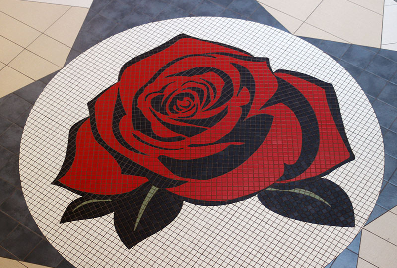 Tiled floor in the design of a red rose
