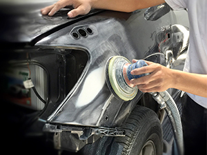 A person buffing a vehicle