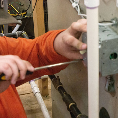 A students repairing a light switch