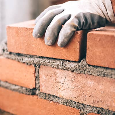 Person laying bricks