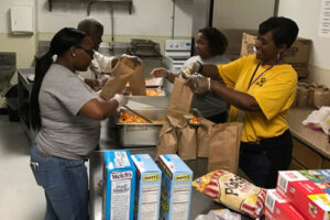 Ladies preparing lunches in the school kitchen