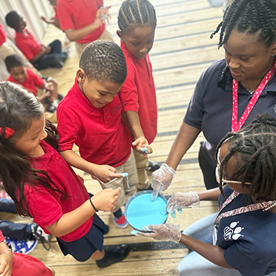 Group of happy students working on a project together