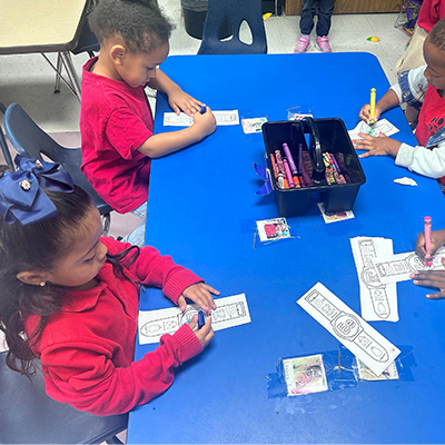 Students working together at a table in a classroom