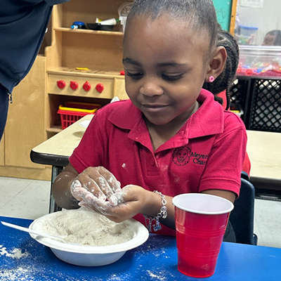 Elementary school girl working on a project in the classroom