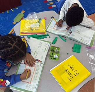 Students engaged in a learning activity at their desks in the classroom