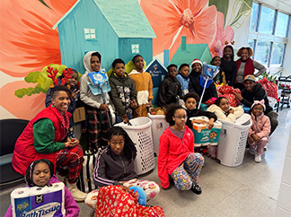 Group of students bringing donations to My Sister's House