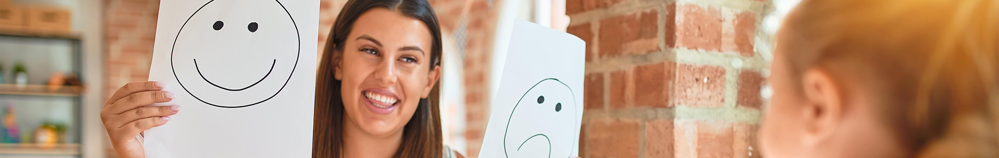 rbt teaching about feelings with a happy and sad face