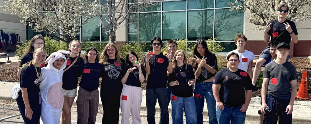 group of high school students standing outside of Addenbrooke Classical
