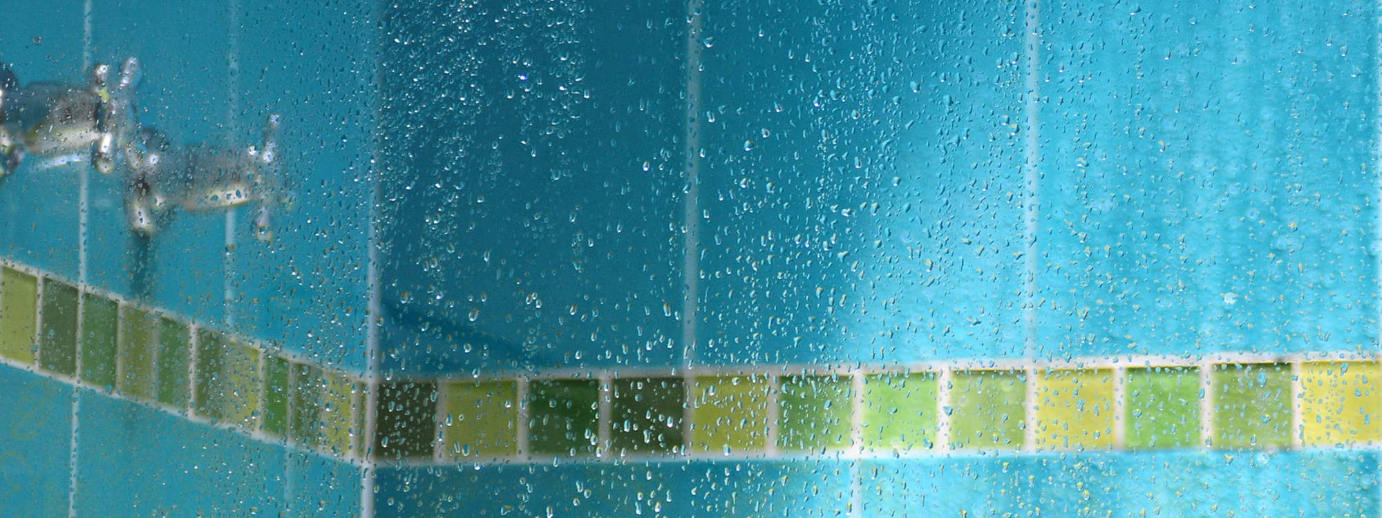 water droplets on a glass shower wall